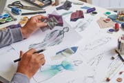 Fashion designer stylish drawings sketches textile fabric material Costume. Designer creative workshop studio.