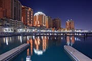 'The Pearl' marina illuminated at night on the outskirts of Doha. Spanning four million square meters 'The Pearl' will be the first land in Qatar available for freehold ownership by foreign nationals